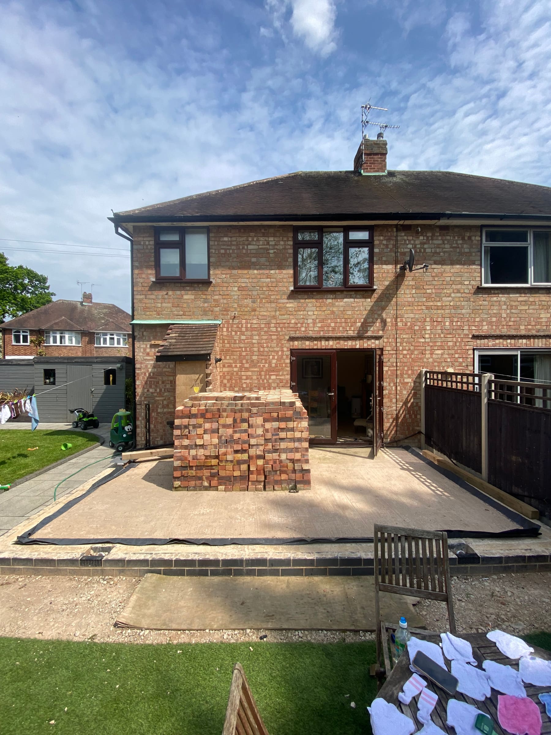 Base stage with reclaimed bricks stacked
