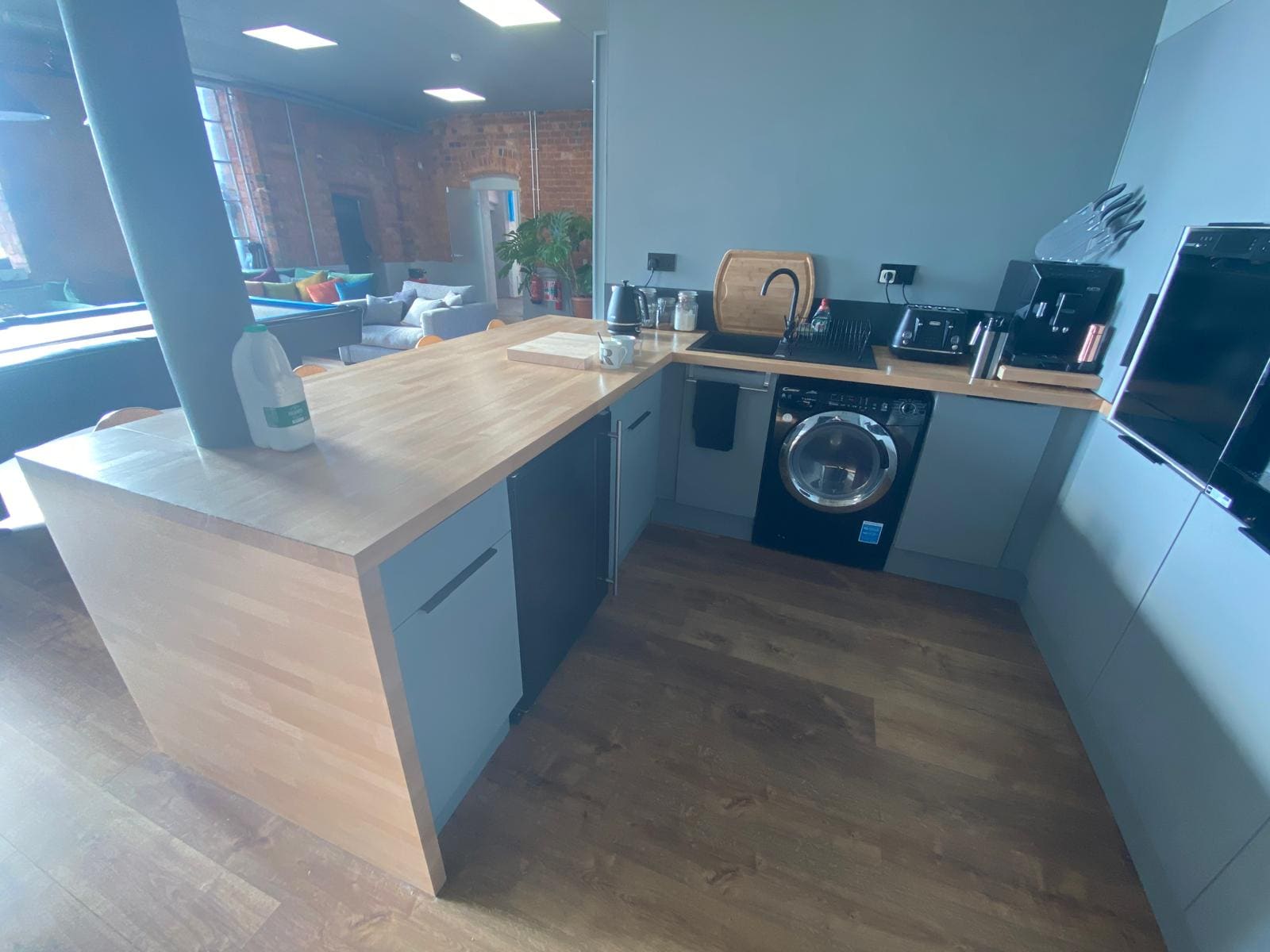 Breakout kitchen with timber breakfast bar and slatted canopy
