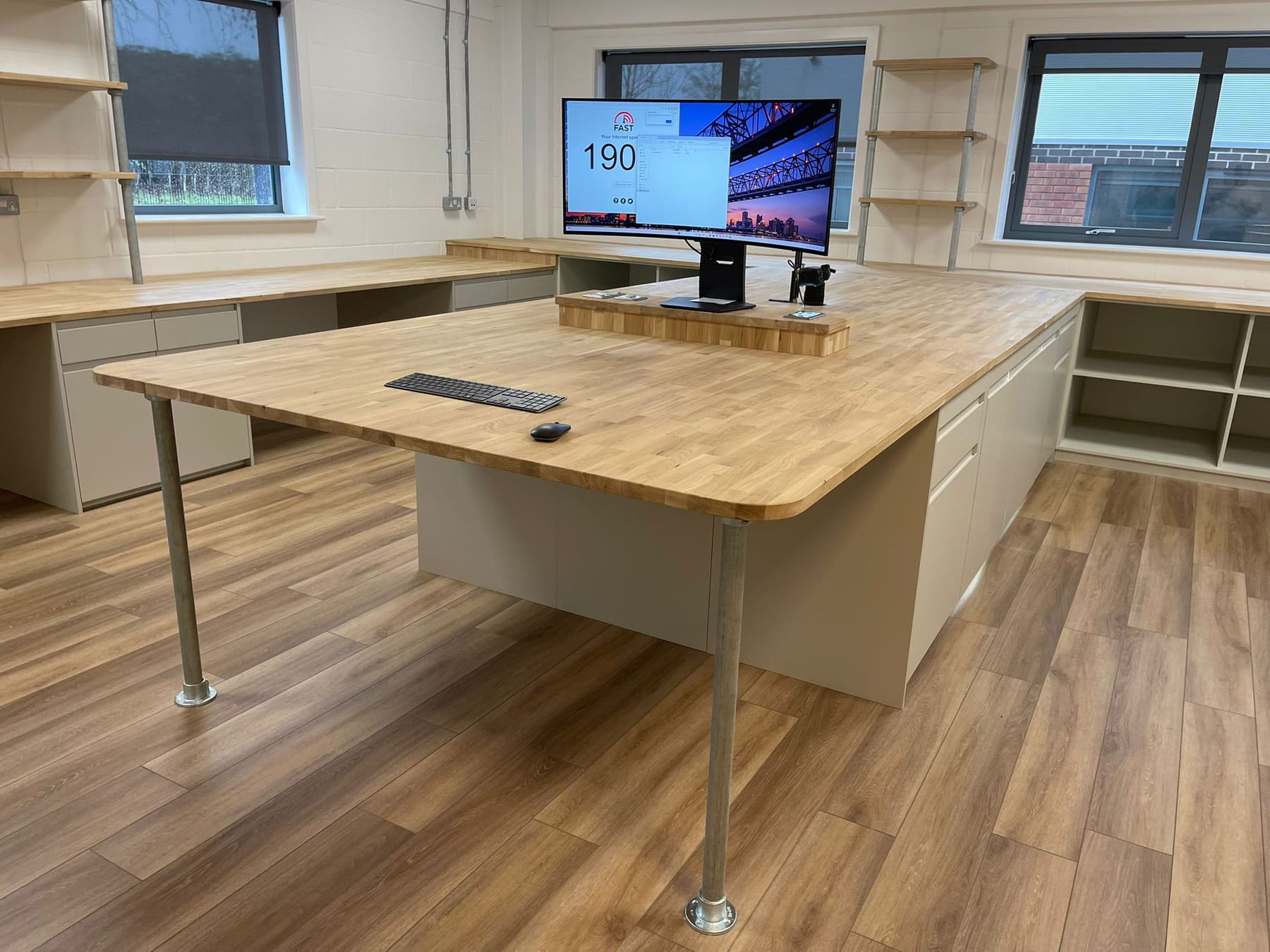A jointed oak desk on galvanised legs, made in the workshop