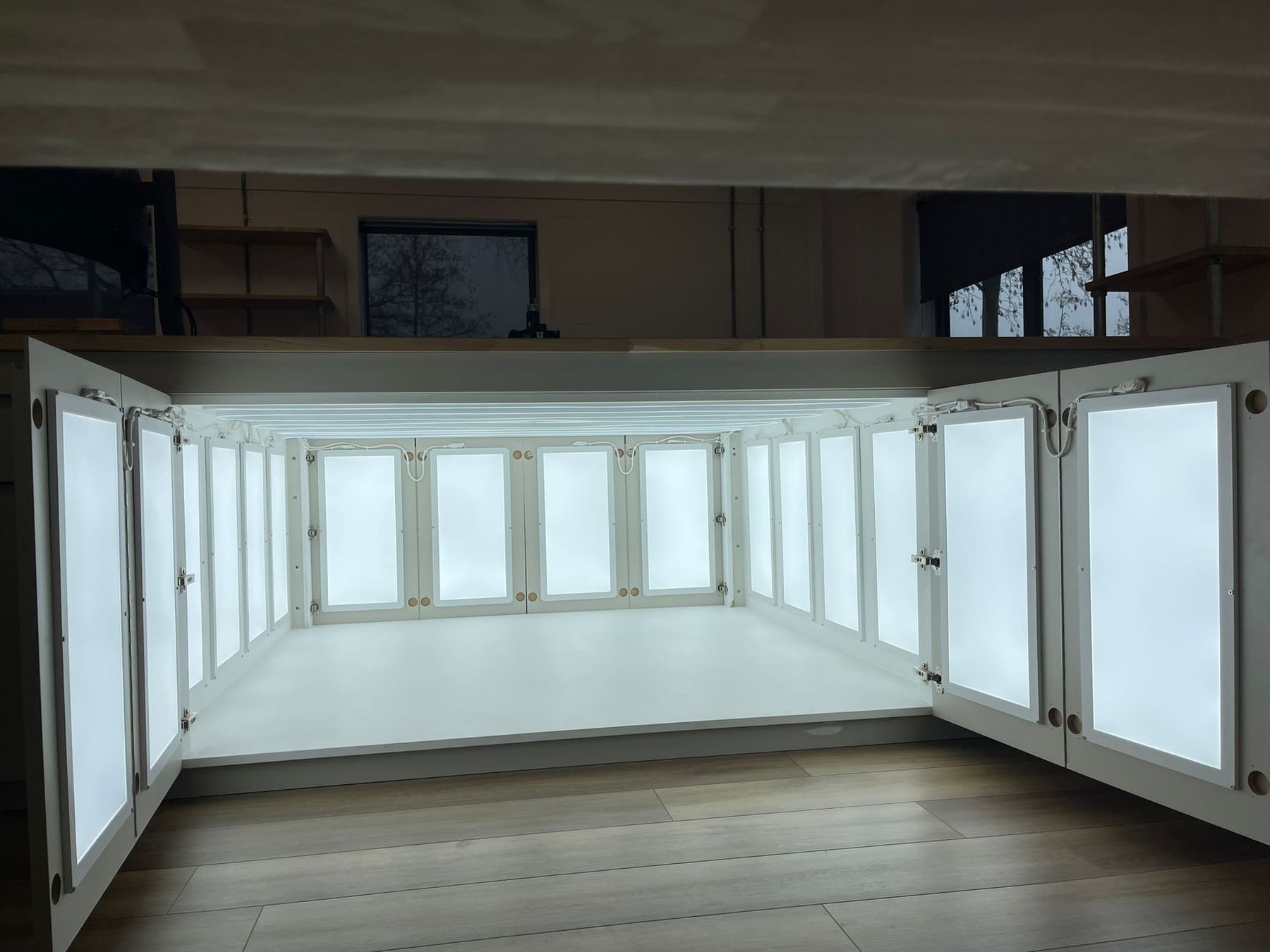 Joinery unit with an internally illuminated lightbox interior