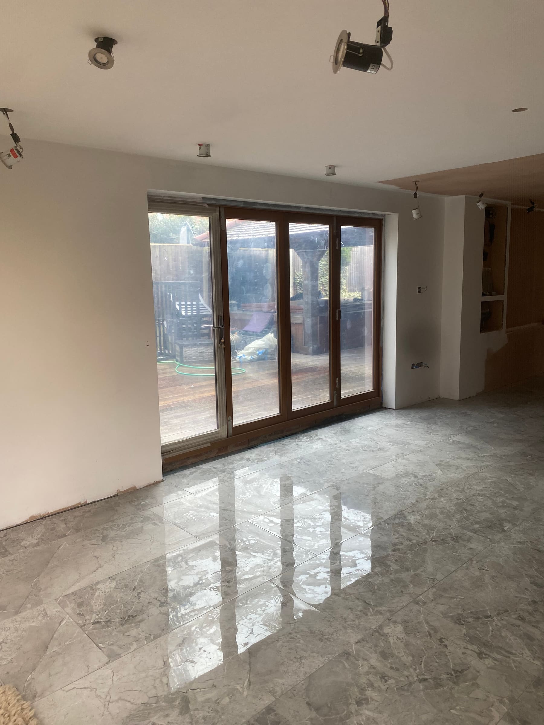 Polished floor meeting the timber bi-folds
