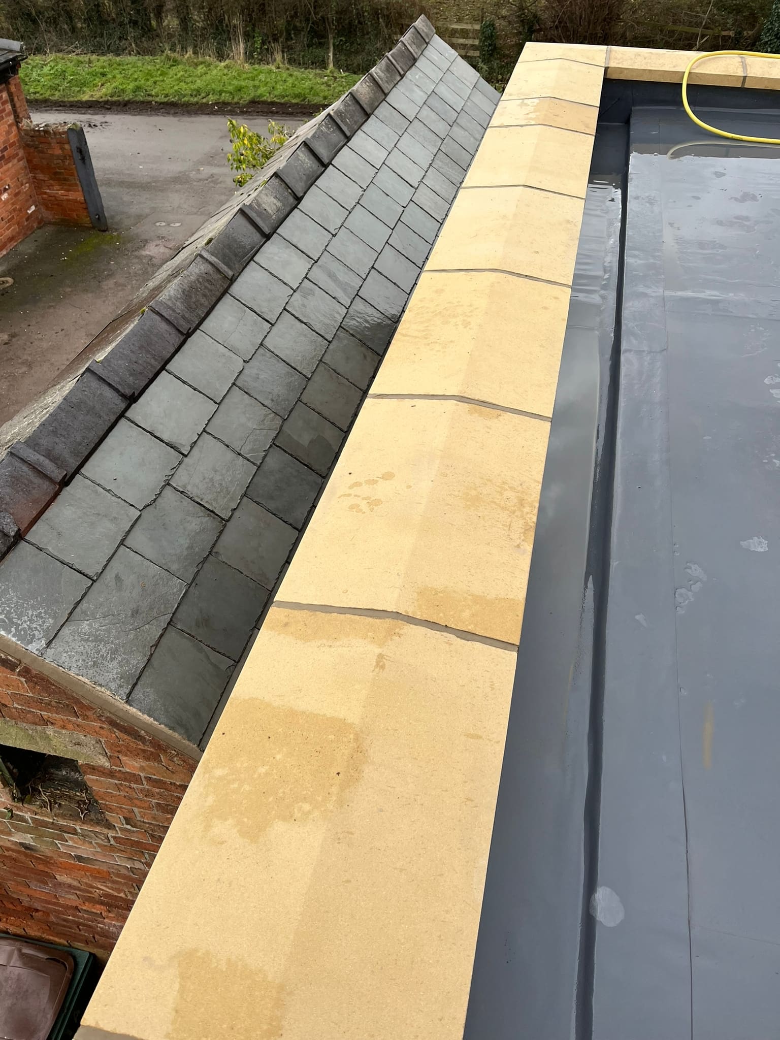 Slate pitch meeting the new fibreglass roof